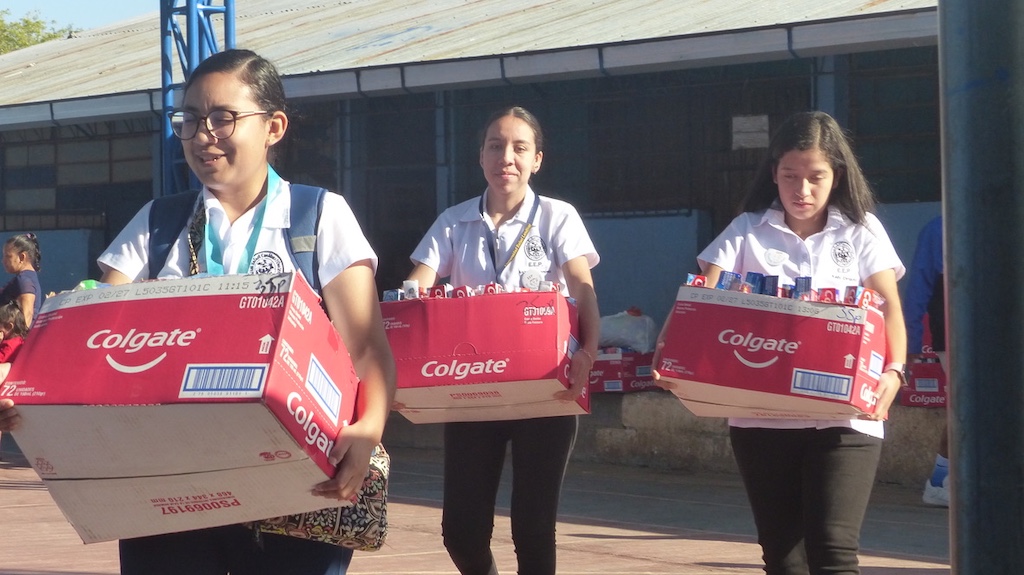 Carrying supplies for the classrooms