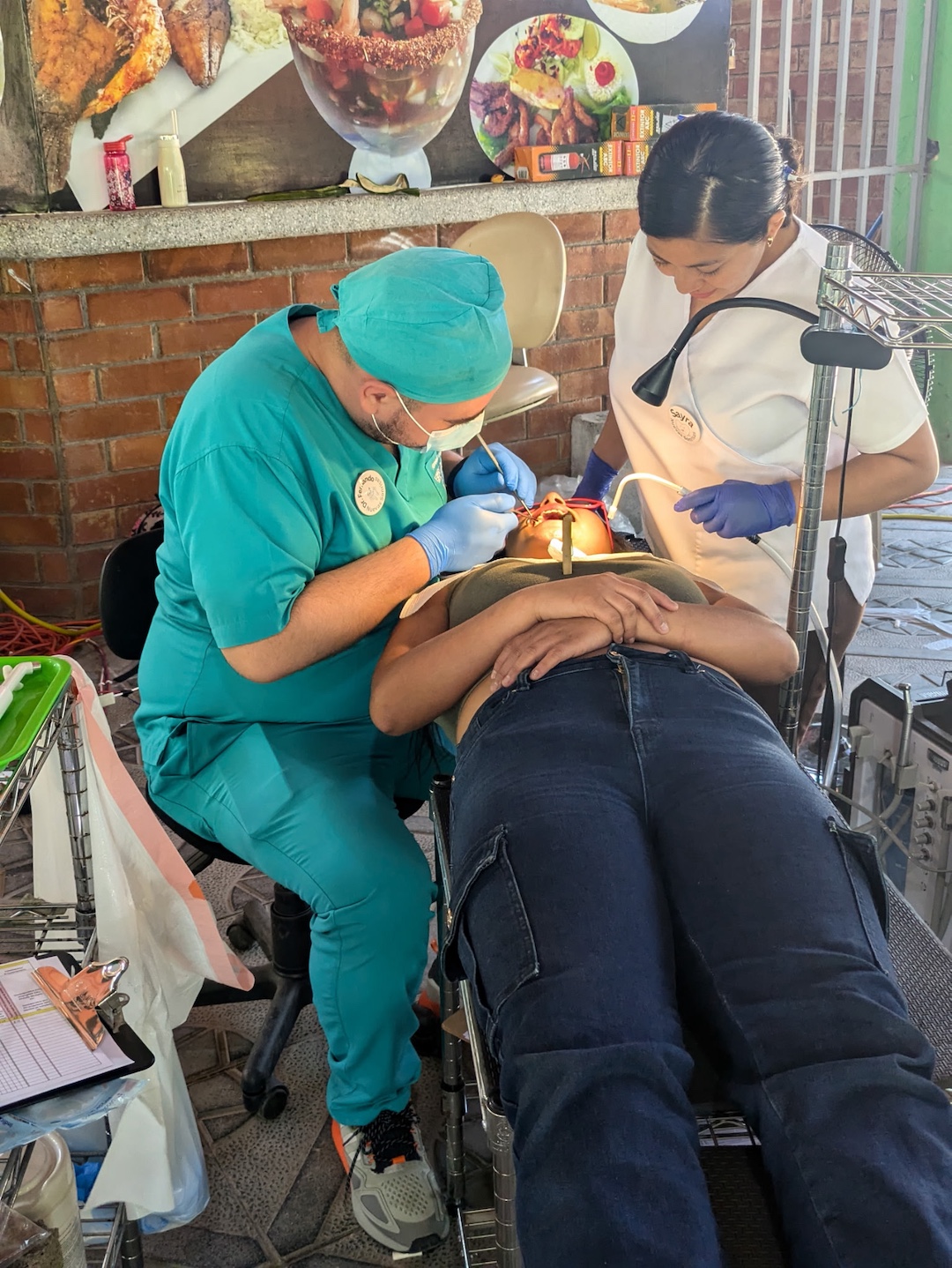 Dr. Fernanado child on chair, wearing sunglasses