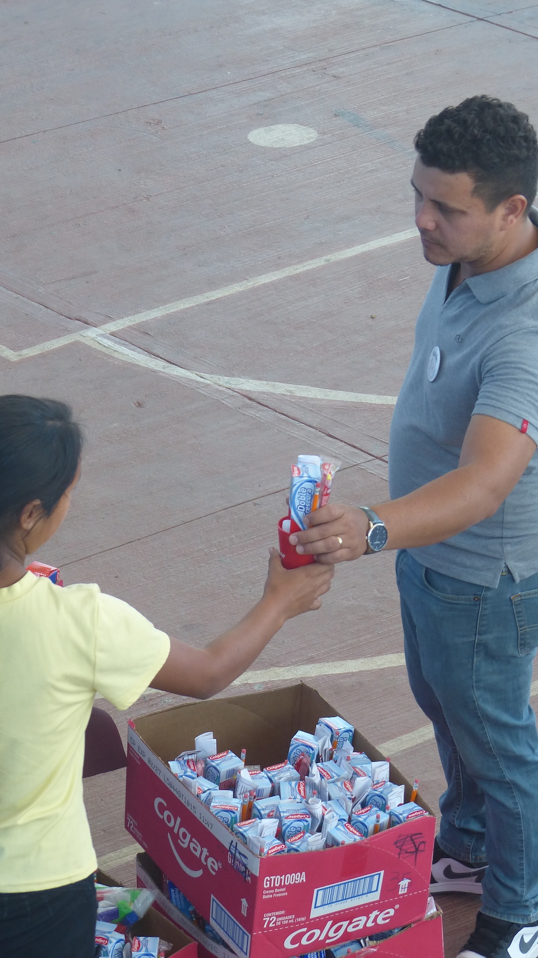 Passing out Colgate kits