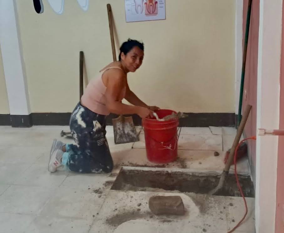 SpencerDonation-Photo1 schoolroom with dental stations, patients and providers