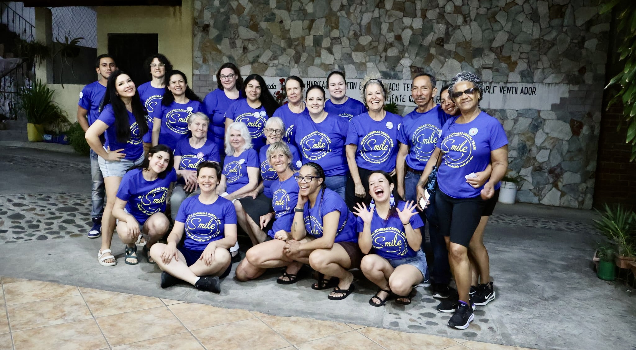 2027 team posed group shot of 40 volunteers in team shirts